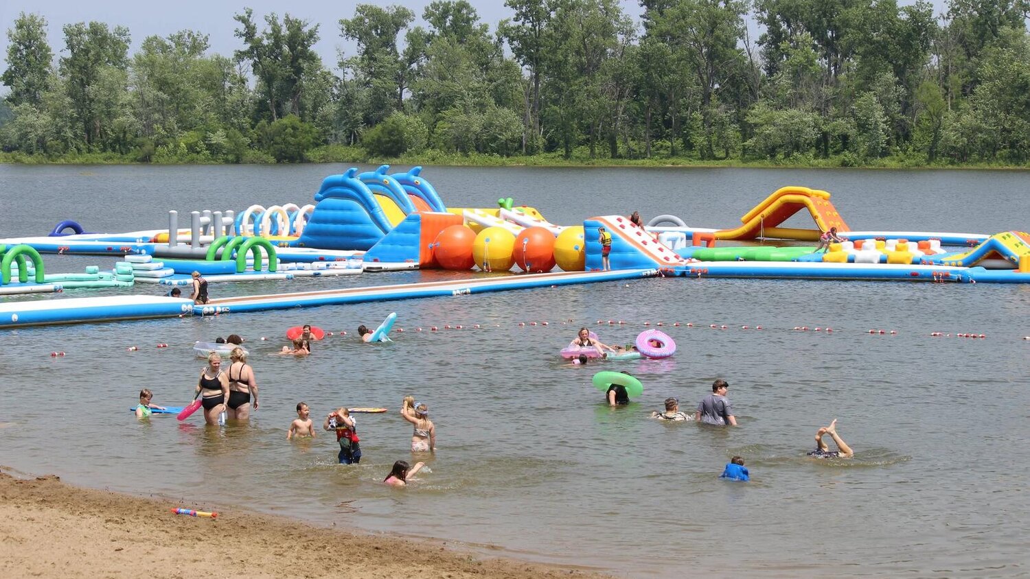 Inflatable aqua park and water park on the lake