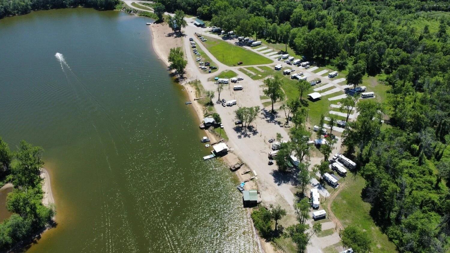 Wide view of Lazy L Lake Campground RV rental area